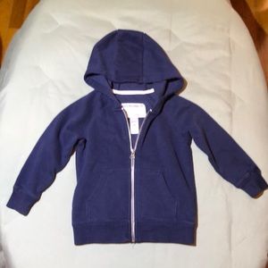Child’s zipper hoodie sweatshirt.